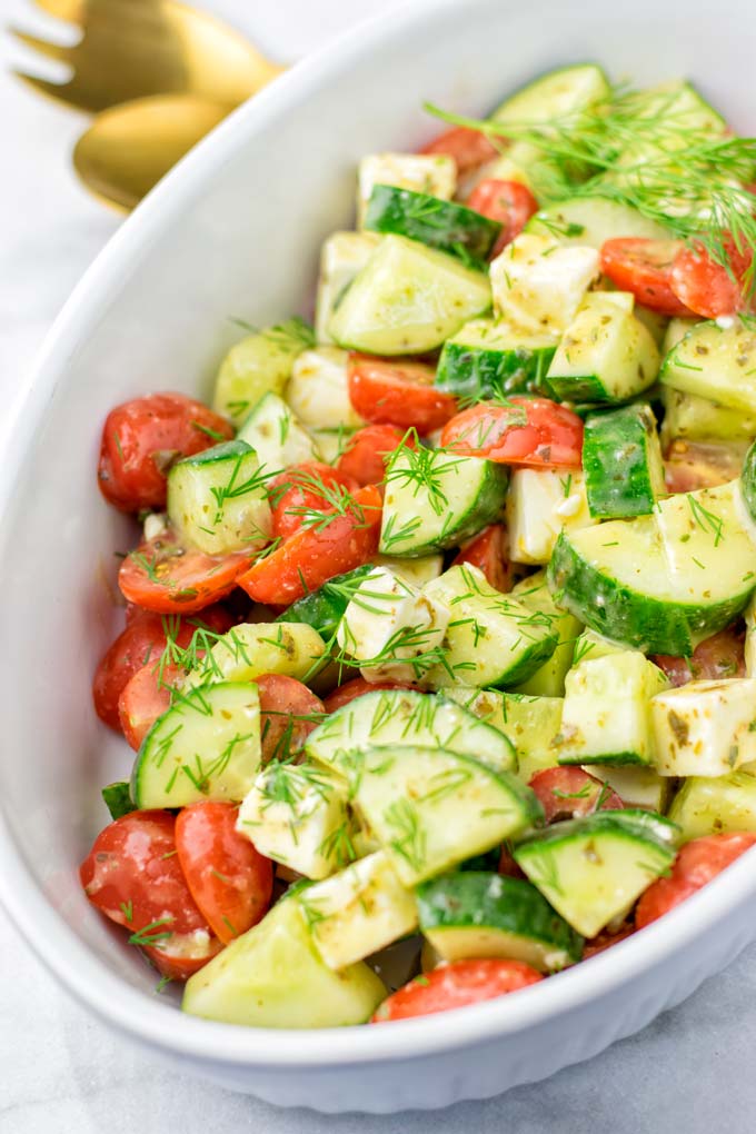 Chop your favorite tomatoes and ca cucumber in not too small pieces.
