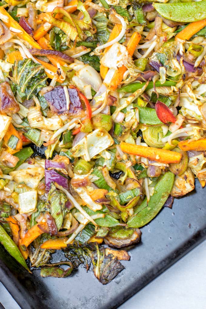 Cabbage, sugar snaps, and carrots are among the veggies on this sheet pan.