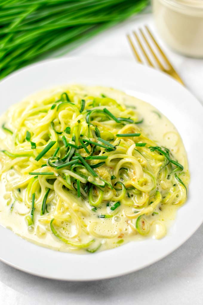 Closeup of the zoodles covered in keto Alfredo sauce. 