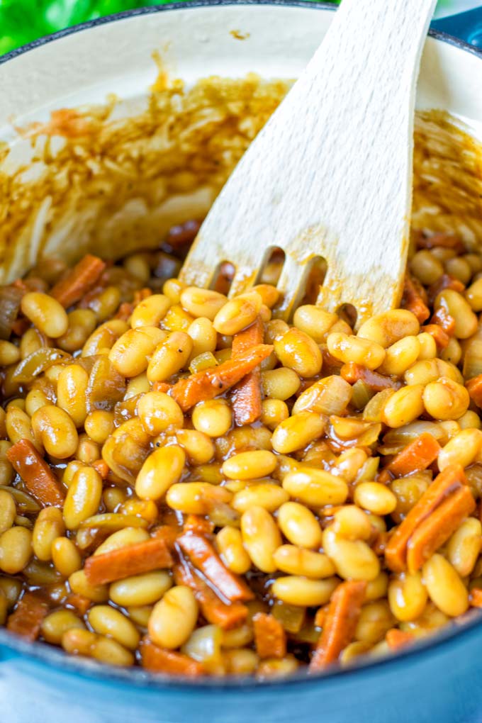 Closeup view showing a wooden spoon in the Dutch oven.