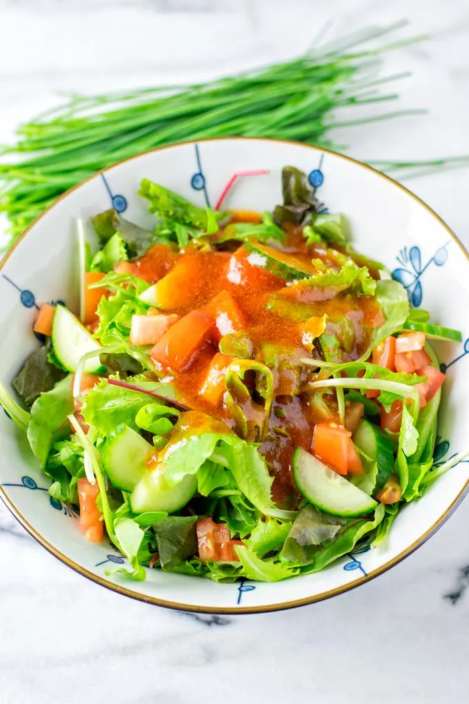 Mix dressing and the salad in a bowl.