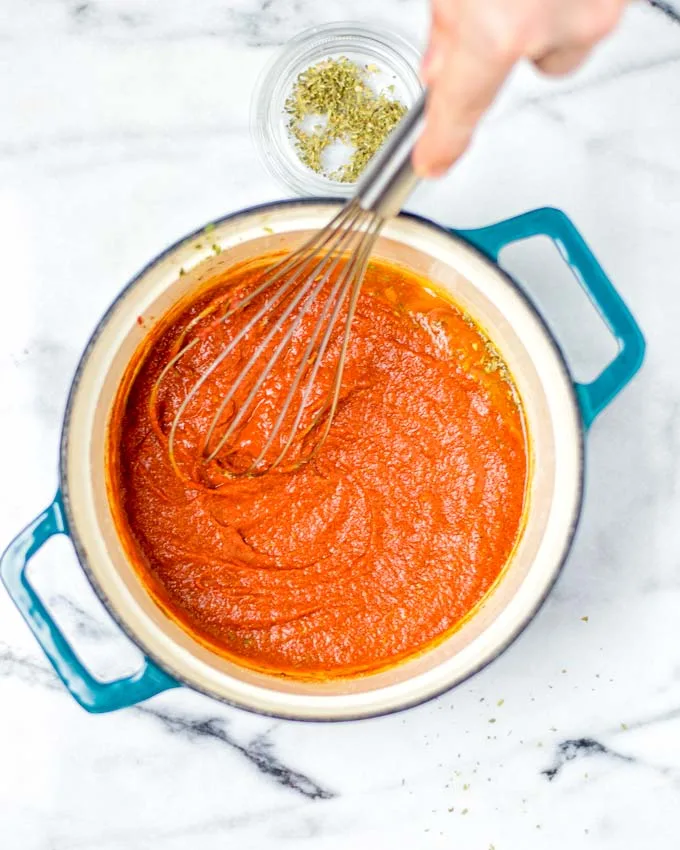 Whisking everything together for this easy vegan Enchilada Sauce.