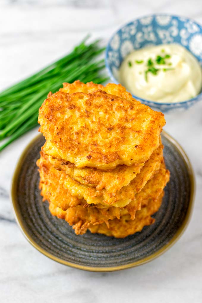 Stack of potato cakes on a blue plate.