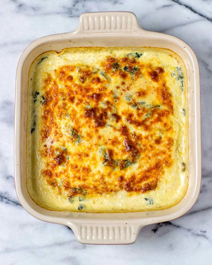 Golden baked baking dish full of pumpkin lasagna.