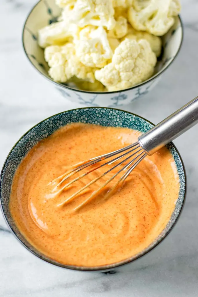 The sauce is great for dipping vegetables such as the cauliflower in the background.