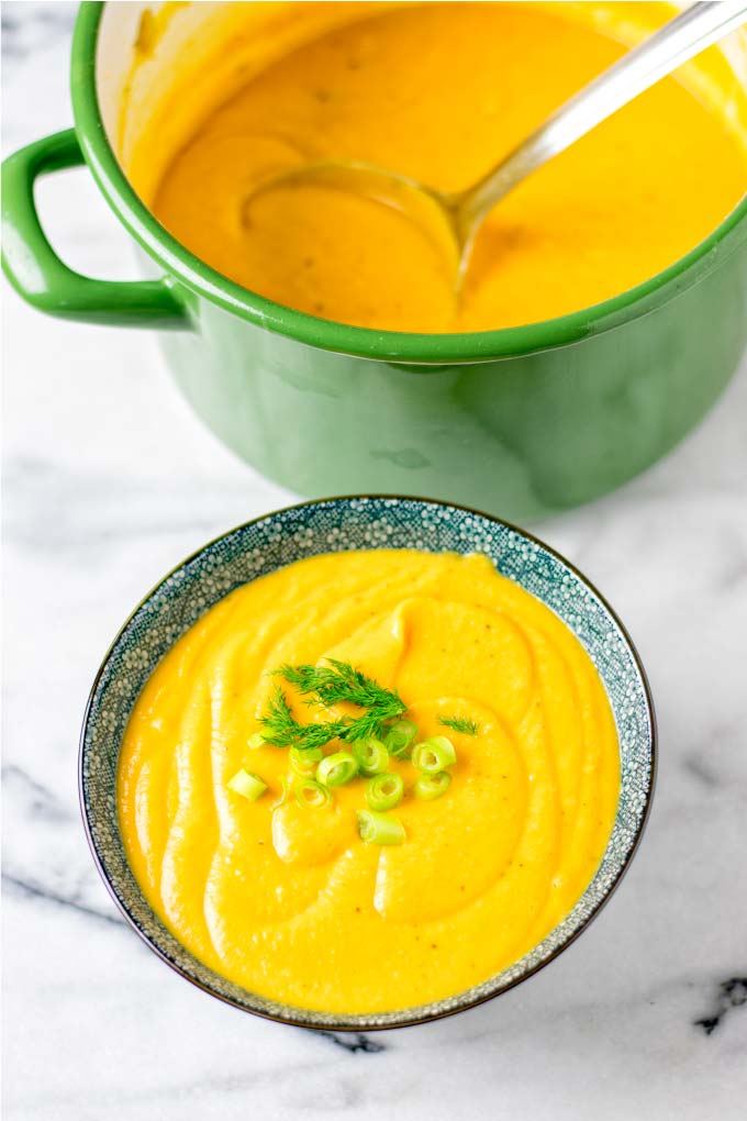 Large green pot in the background with the vegan Sweet Potato Soup.