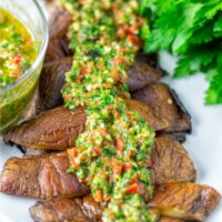 Chimichurri Sauce is given over Portobello mushrrom steak strips.