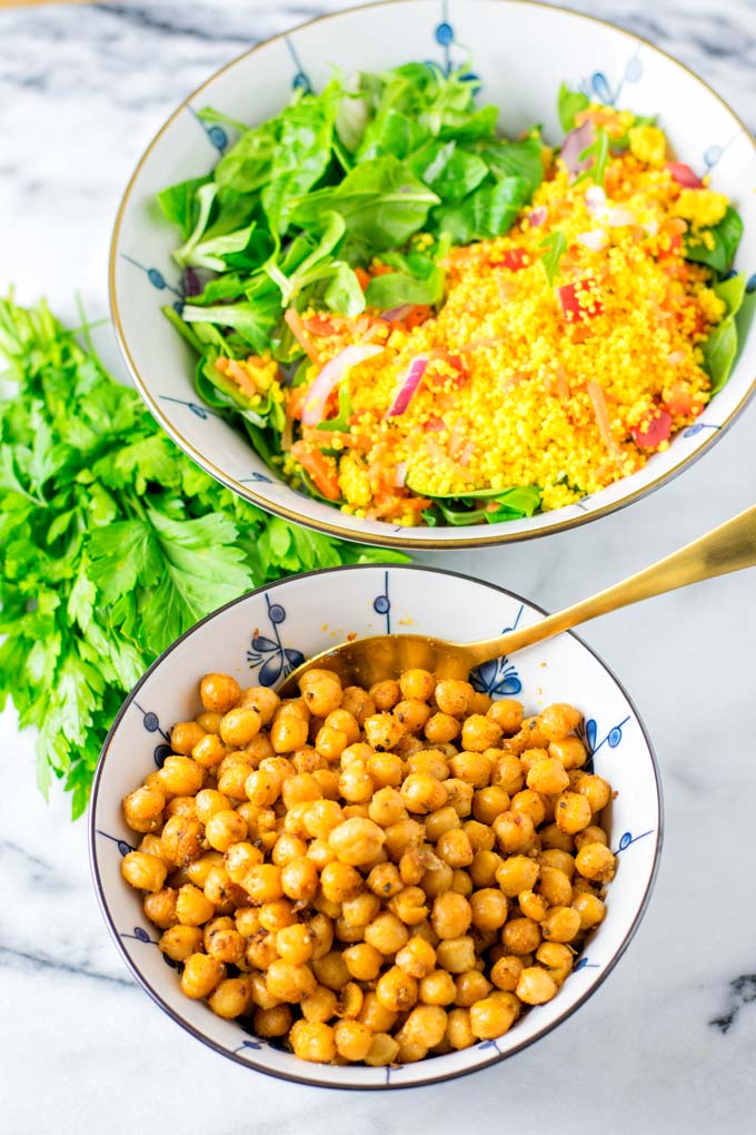 Bowl of Roasted Chickpeas with a fresh mixed lunch salad in the background.