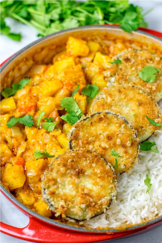 Golden curry, crunchy brown eggplant slices, and aromatic basmati rice make this an easy Indian dish everyone will love.