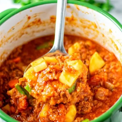 A big spoonful of the Hamburger Soup is taken out of the pot.