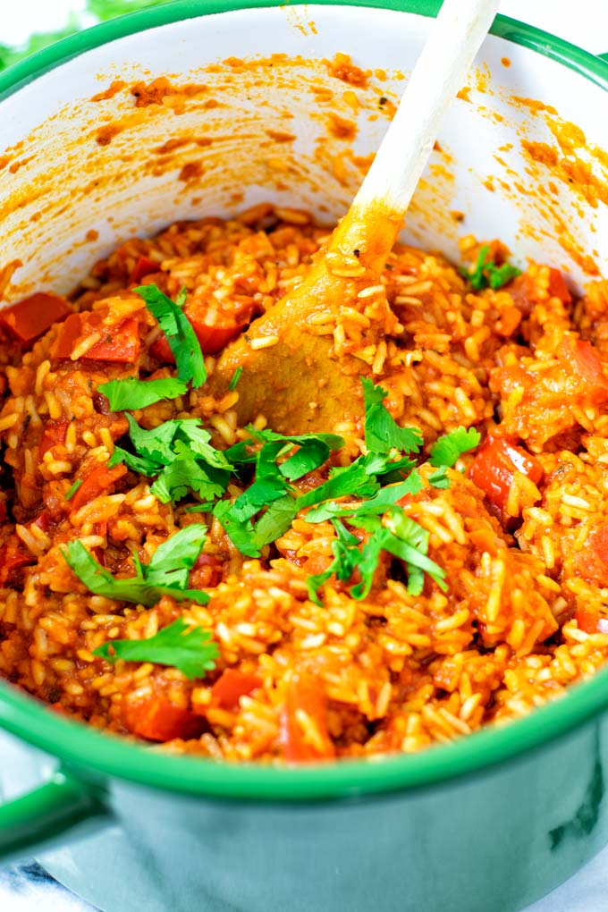 Fresh parsley is used for garnish of the Jollof Rice.