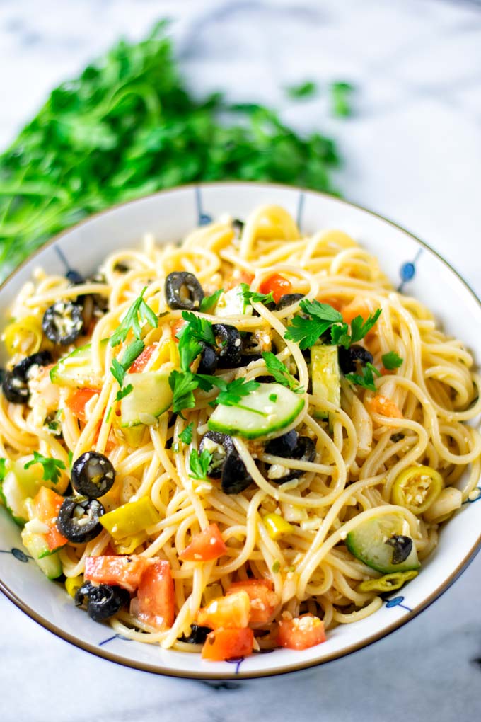 Closeup view of the Spaghetti Salad garnished with fresh parsley.