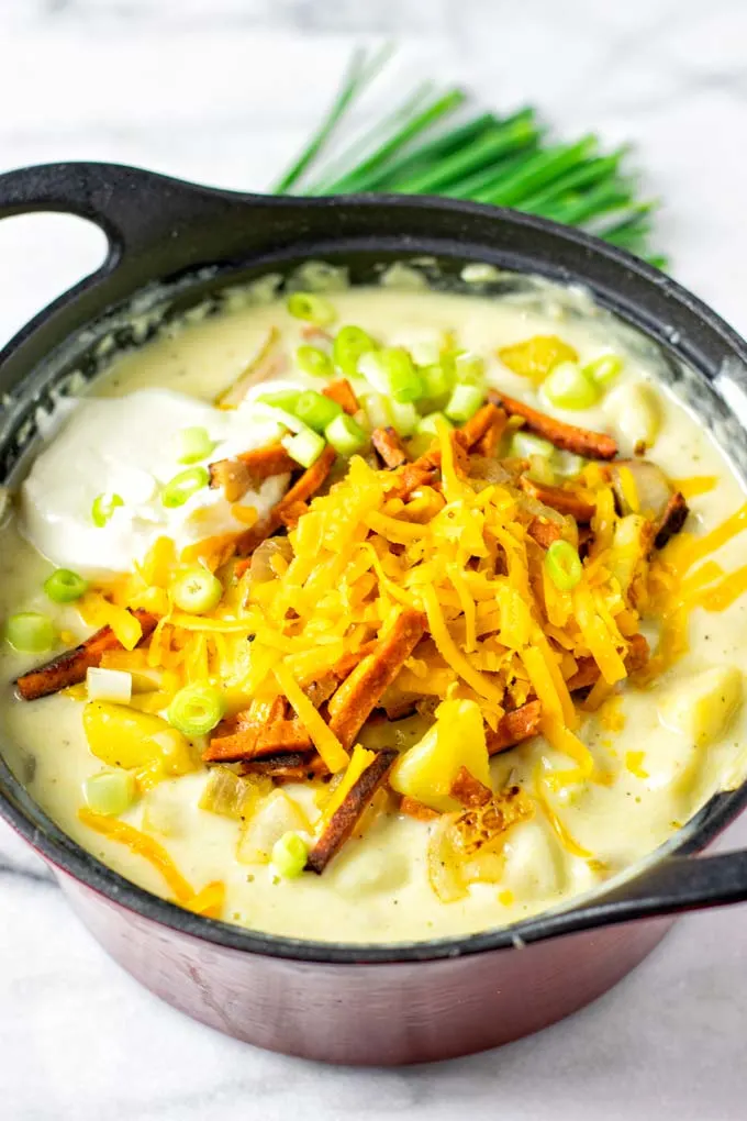 View of the Loaded Potato Soup in a red sauce pan.