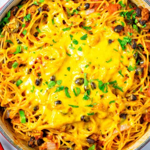 Top view on the red casserole with the ready Taco Spaghetti.
