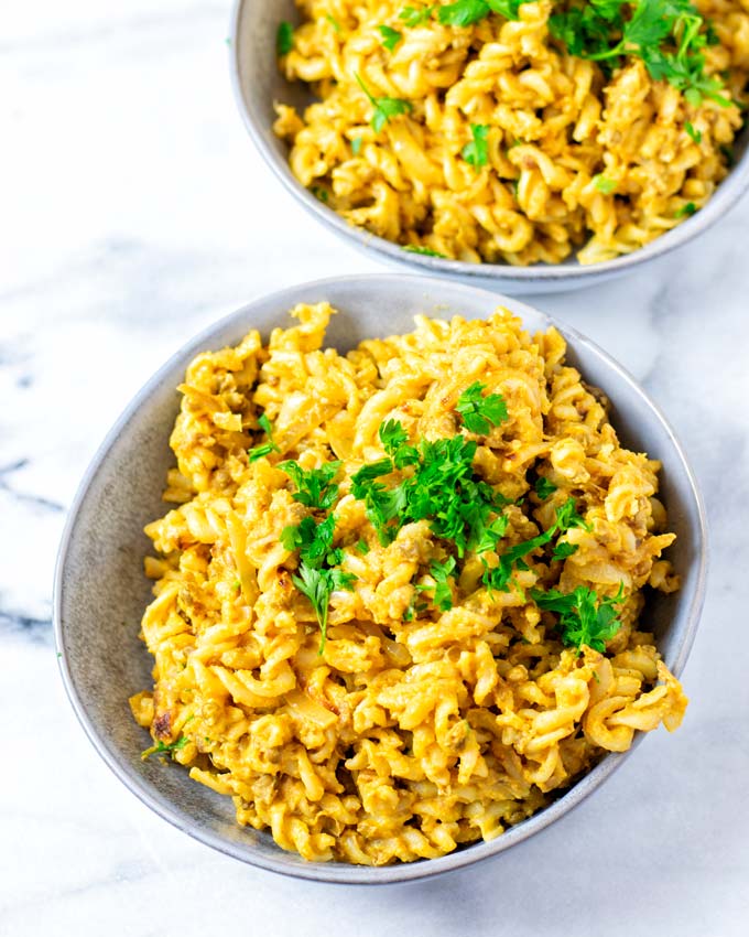 Large Lentil Pasta portion on a plate, garnished with fresh herbs.