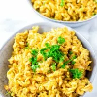 Closeup view of the pasta covered in creamy lentil sauce.