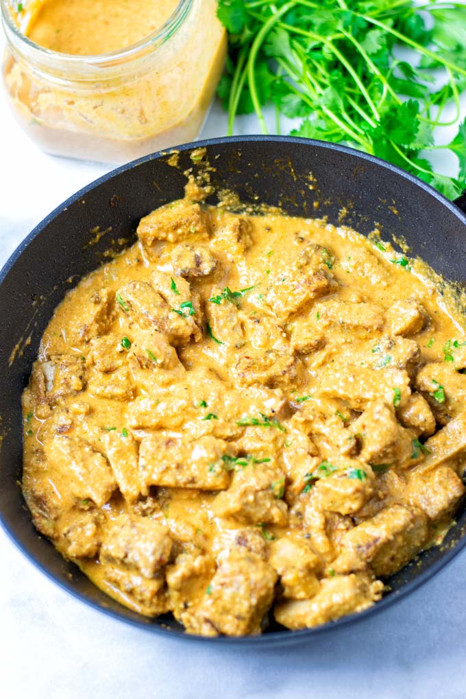 Closeup on a pan with a Tikka Masala dish.