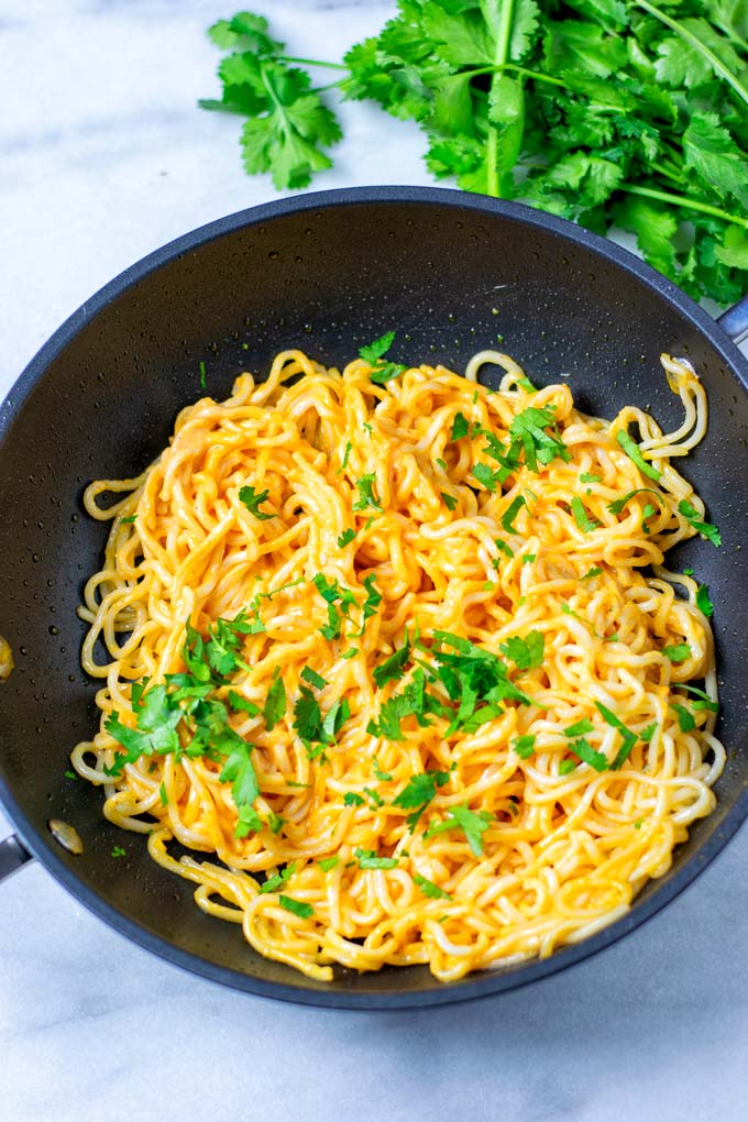 Cajun Pasta in a sauce pan garnished with parsley.
