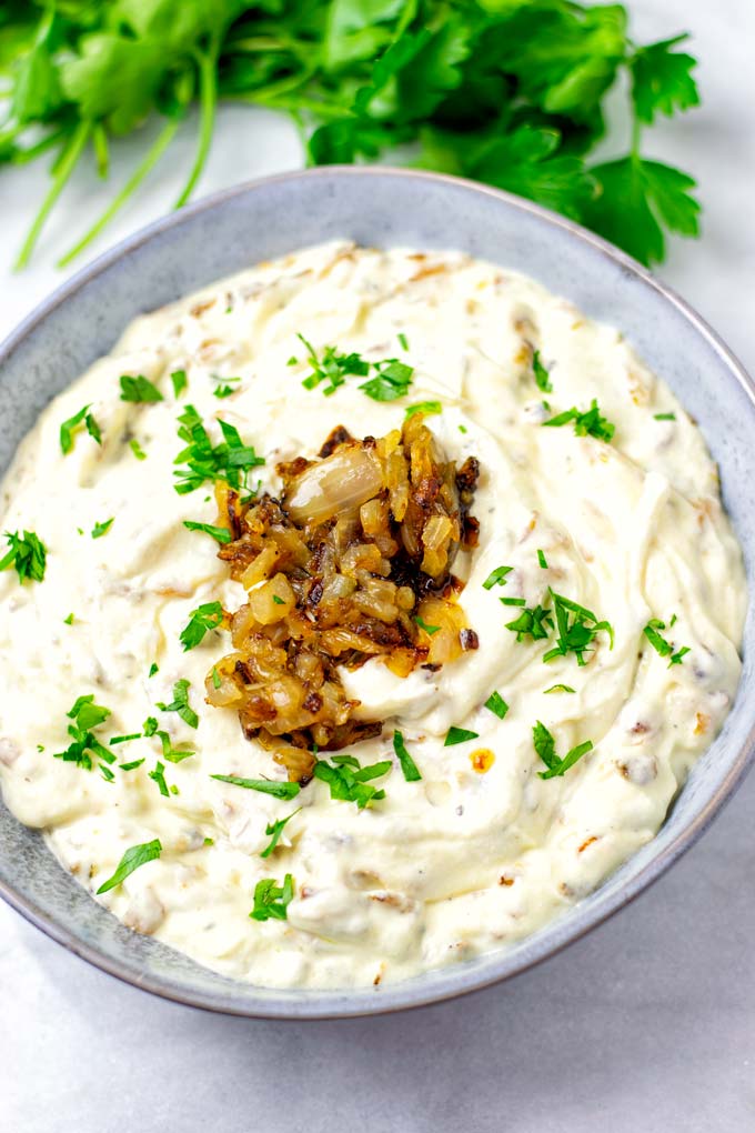 A bowl with the French Onion Dip with extra onions.