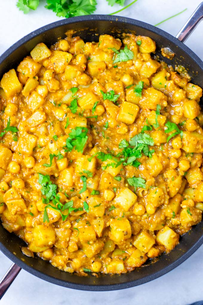 View from above on the frying pan filled with the Potato Curry, garnished with cilantro.