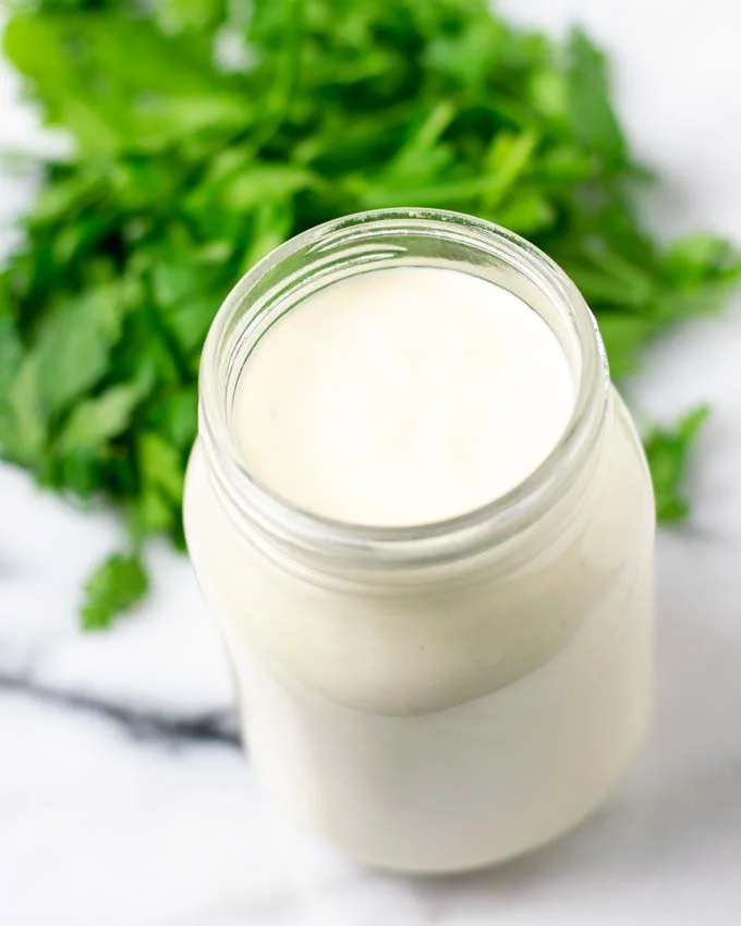 Alfredo Sauce in a glass jar.