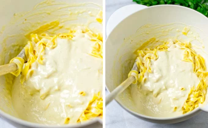 Alfredo Sauce is mixed with pasta in a white bowl.