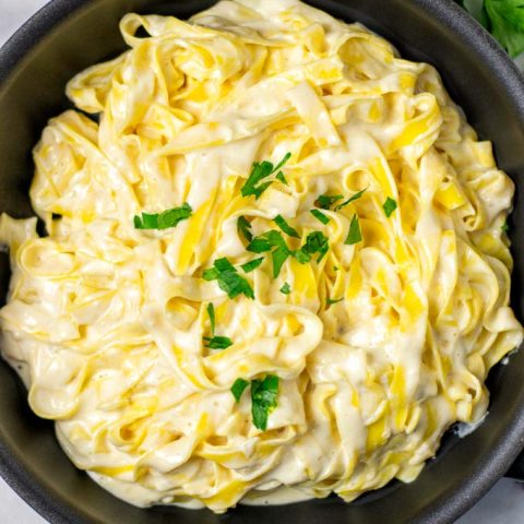 Portion of Alfredo pasta in a sauce pan.