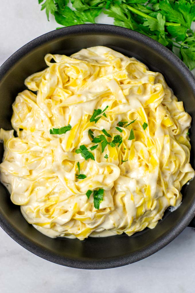 Portion of Alfredo pasta in a sauce pan.