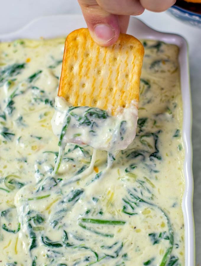 Closeup of a cracker with Spinach Dip.