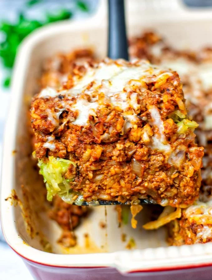 Closeup of a portion of the Cabbage Roll Casserole, lifted with a spoon out of the casserole dish.