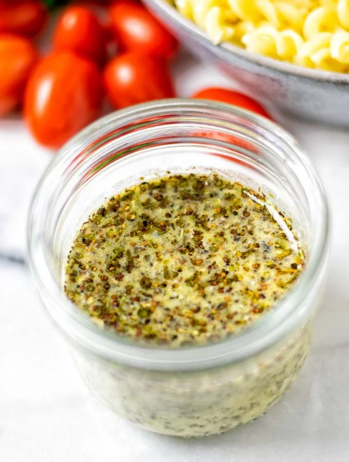 Closeup on the Italian Dressing in a glass jar.