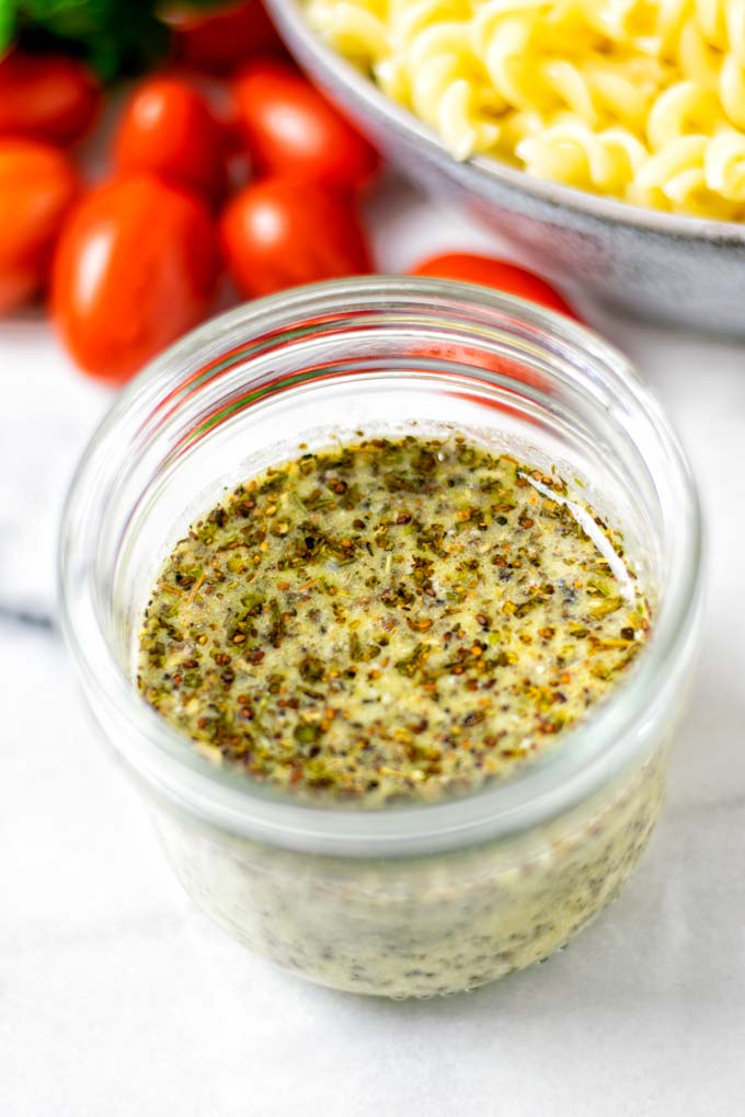 Closeup on the Italian Dressing in a glass jar.