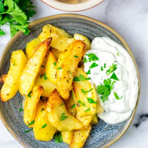 Top view on a portion of Greek Lemon Potatoes.