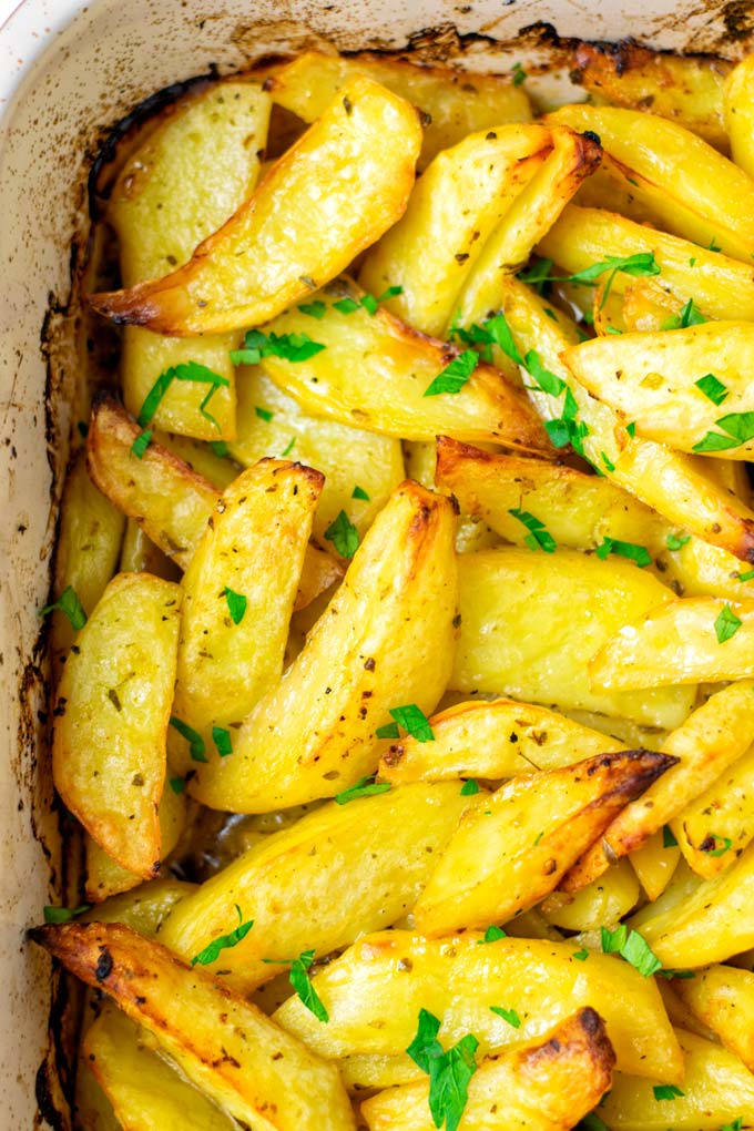 Fresh parsley is given over the Greek Lemon Potatoes.