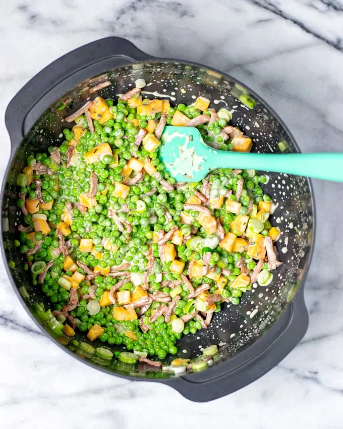 View from above on a large grey bowl with the mixed Pea Salad.