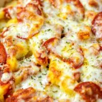 Closeup on the Pizza Fries in a casserole dish.