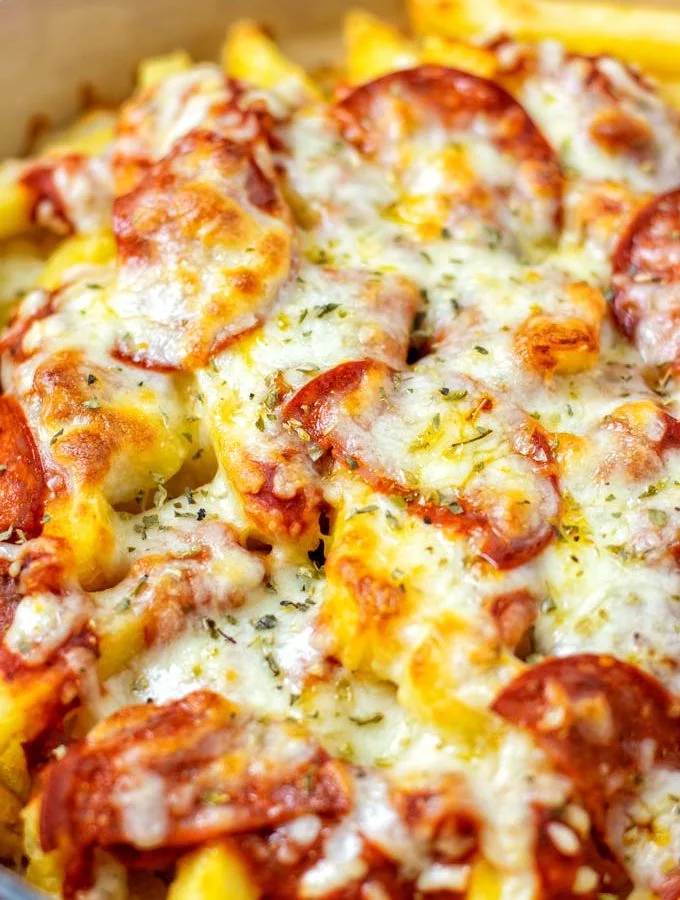Closeup on the Pizza Fries in a casserole dish.