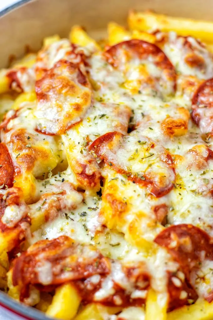 Closeup on the Pizza Fries in a casserole dish.