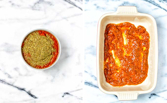 The marinara is mixed with Italian herbs and used as the bottom layer of a casserole dish.