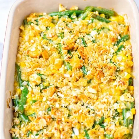 Ready baked Vegetable Casserole in a red casserole dish.