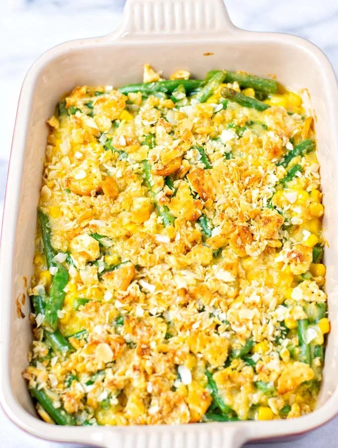Ready baked Vegetable Casserole in a red casserole dish.