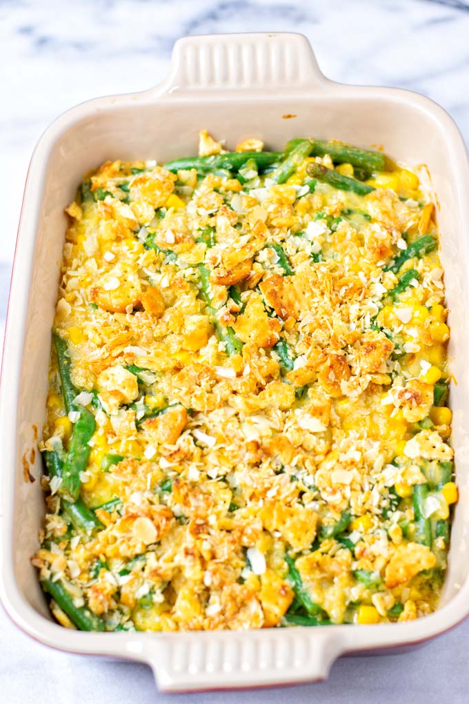 Ready baked Vegetable Casserole in a red casserole dish.