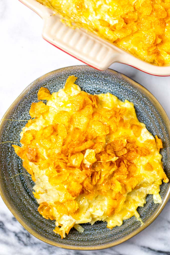 Top view in a portion of the Funeral Potatoes on a small plate. 