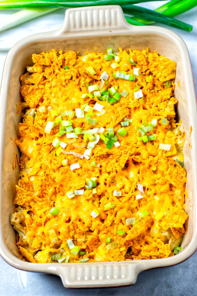 The baked Dorito Casserole is shown with some green onion on top.