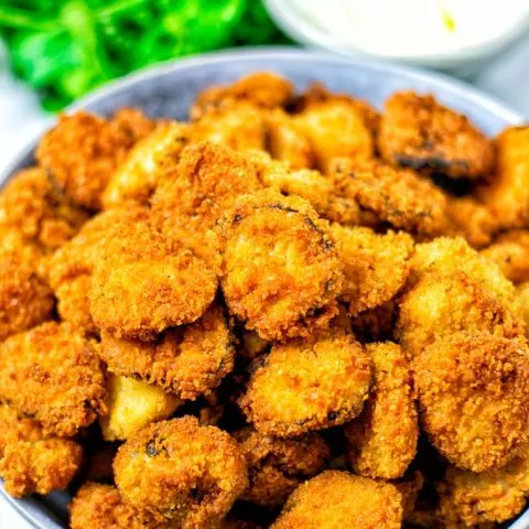 Top view on a plate full of Fried Pickles.