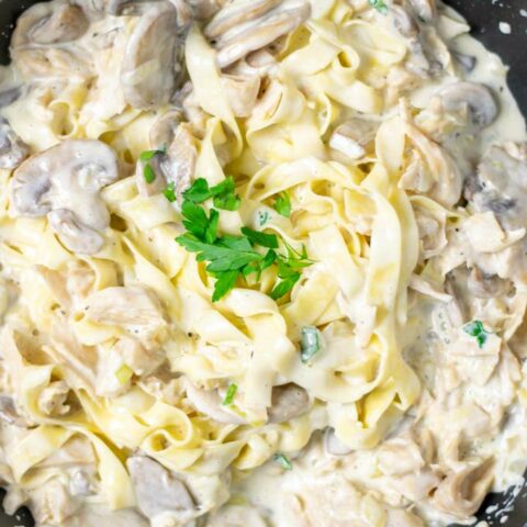 Top view of the Creamy Mushrooms mixed with pasta in a pan.