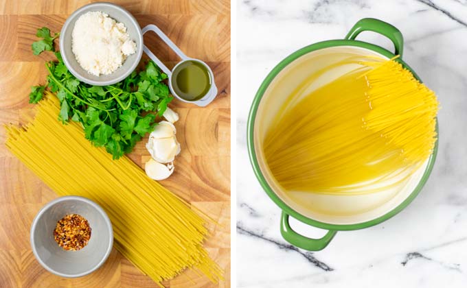 Ingredients needed for the Spaghetti aglio e olio are assembled on a wooden board.