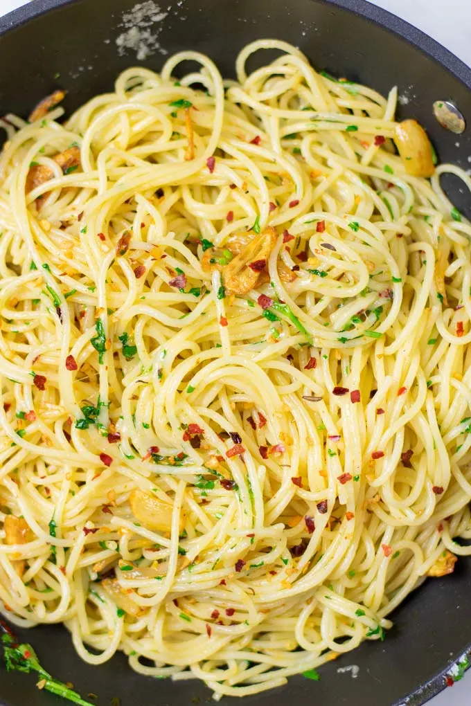 Closeup of the finished dish with the fried garlic and chilli flakes clearly visible.