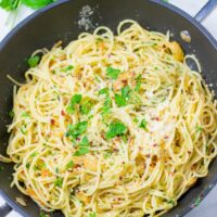 Spaghetti aglio e olio in a large pan.