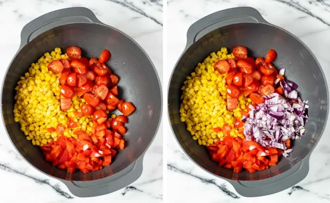 Corn, red onions, cherry tomatoes and bell pepper are mixed in a large bowl.
